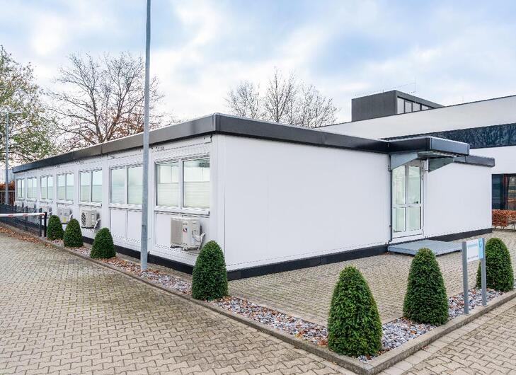 Kontorarealer i samme stil og farve som den oprindelige bygning