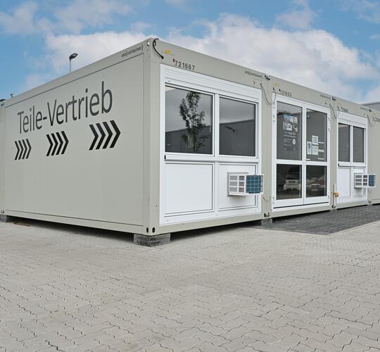 Car dealership from ELA containers