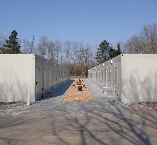 Bostadsanläggning bestående av uppradade moduler