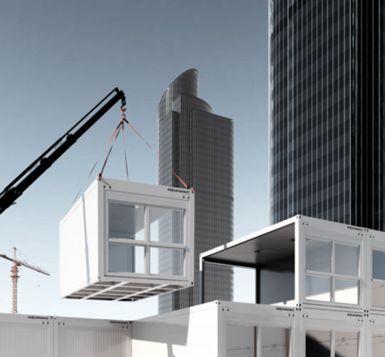 A container being lifted into place by a crane