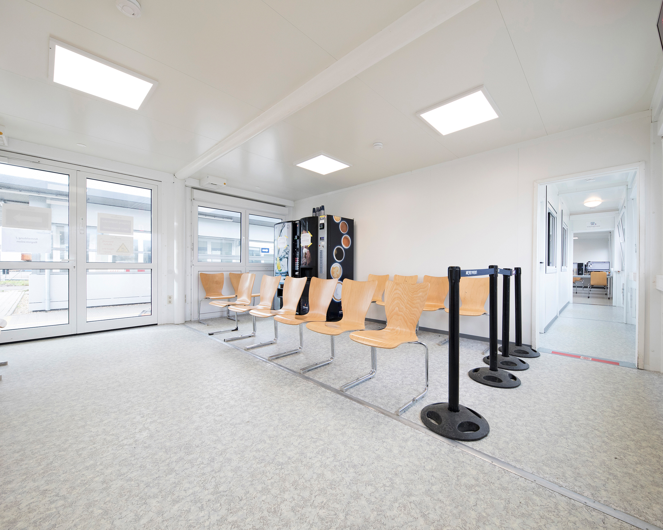 Double glass doors and a separate waiting area provide a friendly reception for the employees. Double glass doors and a separate waiting area provide a friendly reception for the employees.