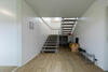 Access to the first floor is provided via an internal staircase, with an external escape staircase installed to provide an additional emergency exit route.