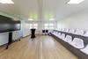 The modular units feature a clean white finish, complemented by anthracite detailing to match the club’s branding and colours.