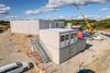 The 102 m² facility comprises four office units and two toilet units.
