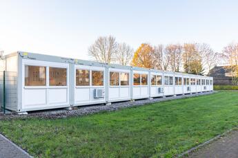 33 ELA containers create a compact school building to serve as a temporary solution.