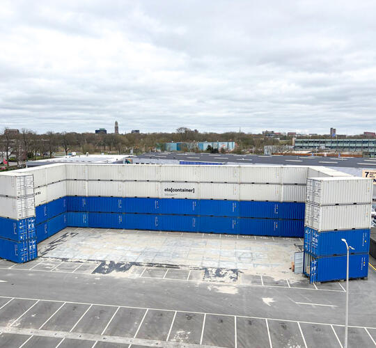 52 storage containers form a four-storey noise barrier