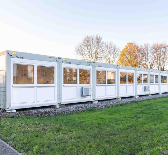 33 ELA containers create a compact school building to serve as a temporary solution.