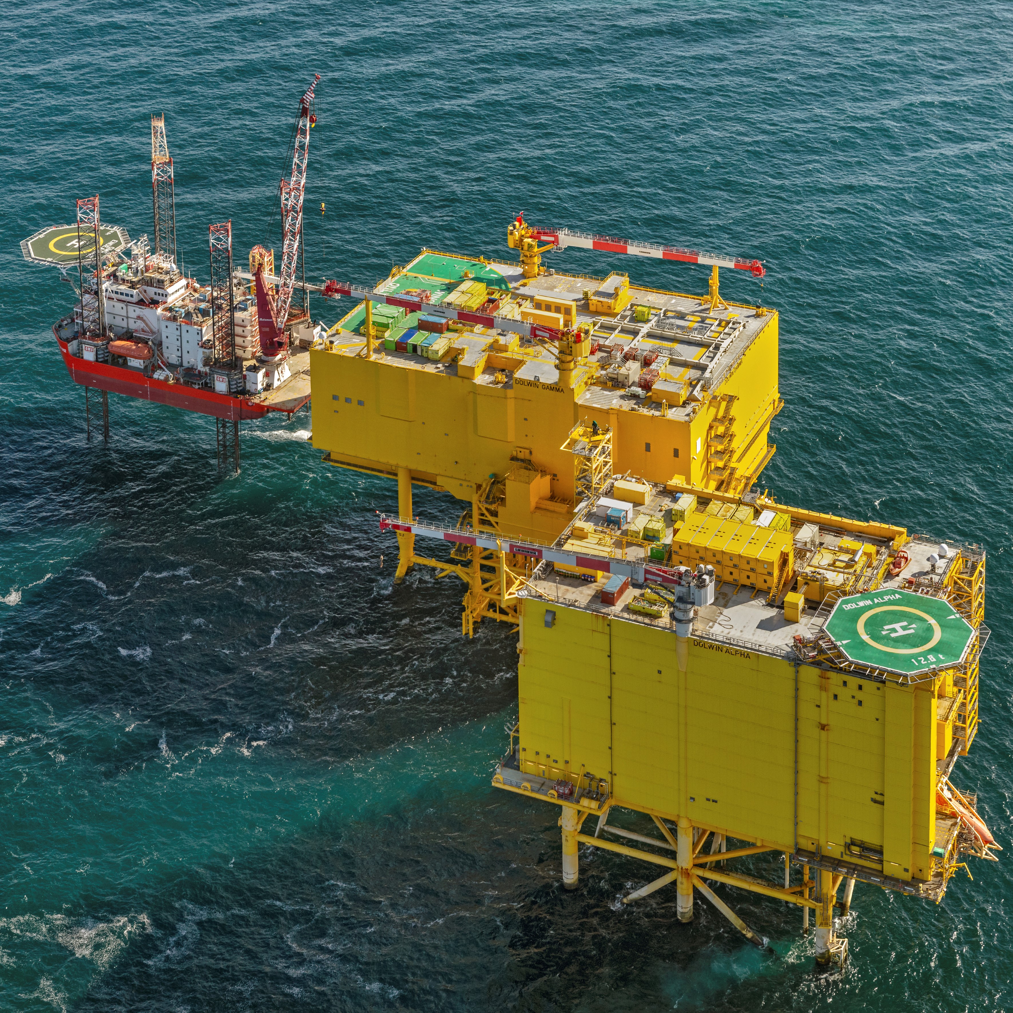 Wind farm converter platform with containers