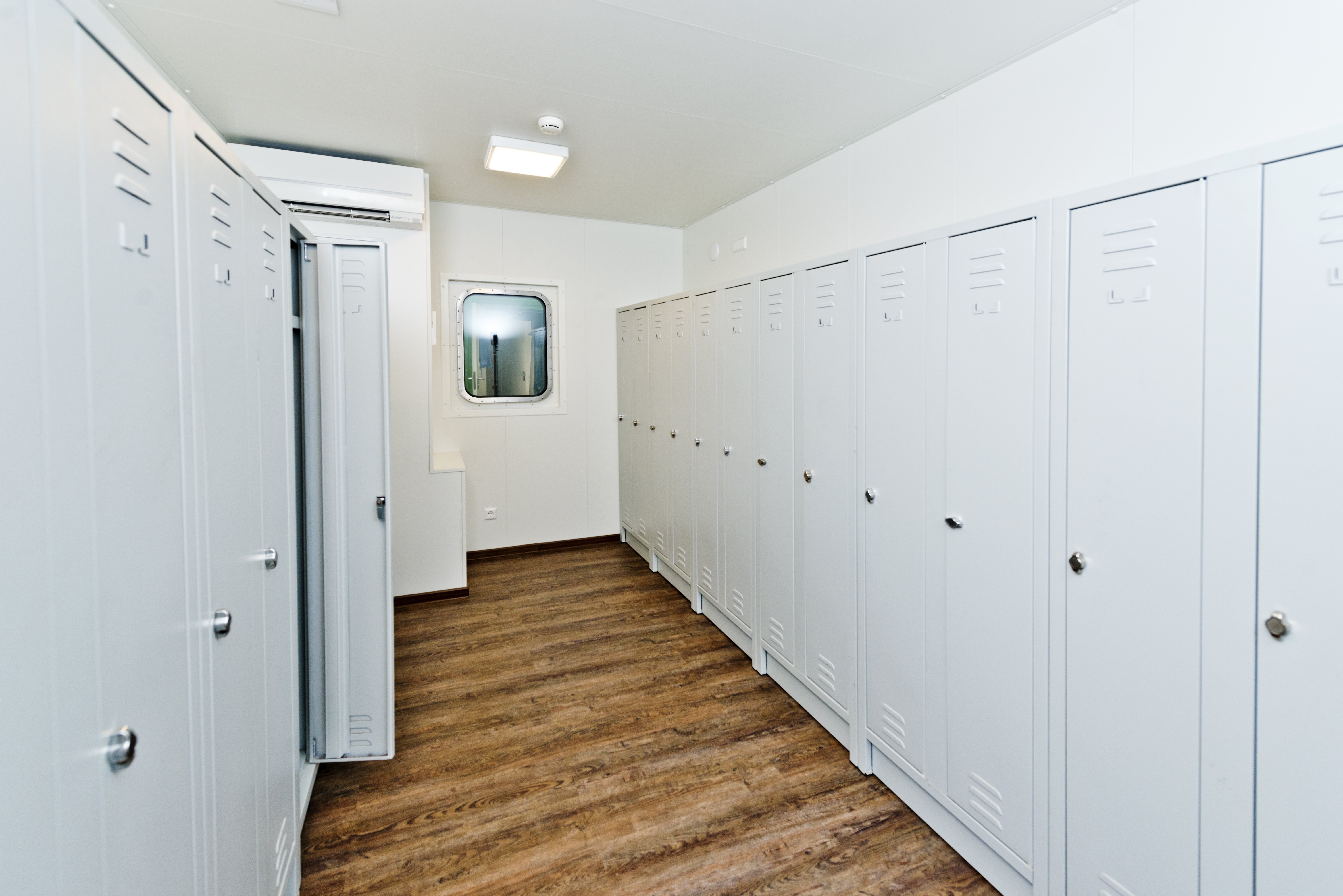 Container equipped as locker room
