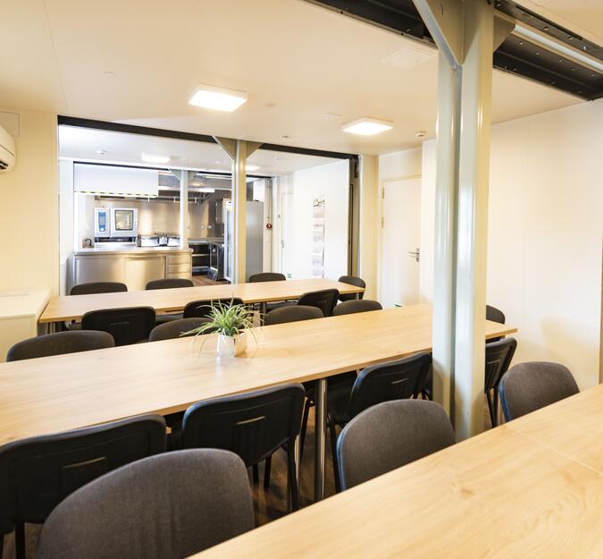 Container equipped with kitchen and dining area