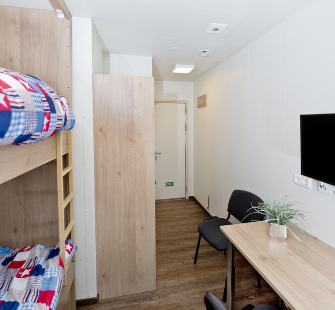 Container equipped as living quarter