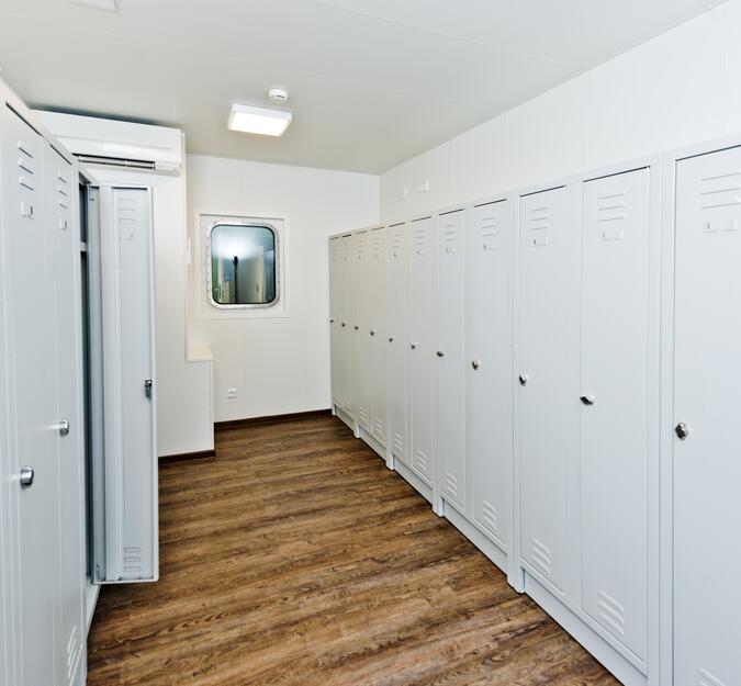 Container equipped as locker room