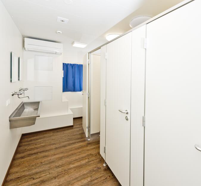 Container equipped as sanitary unit